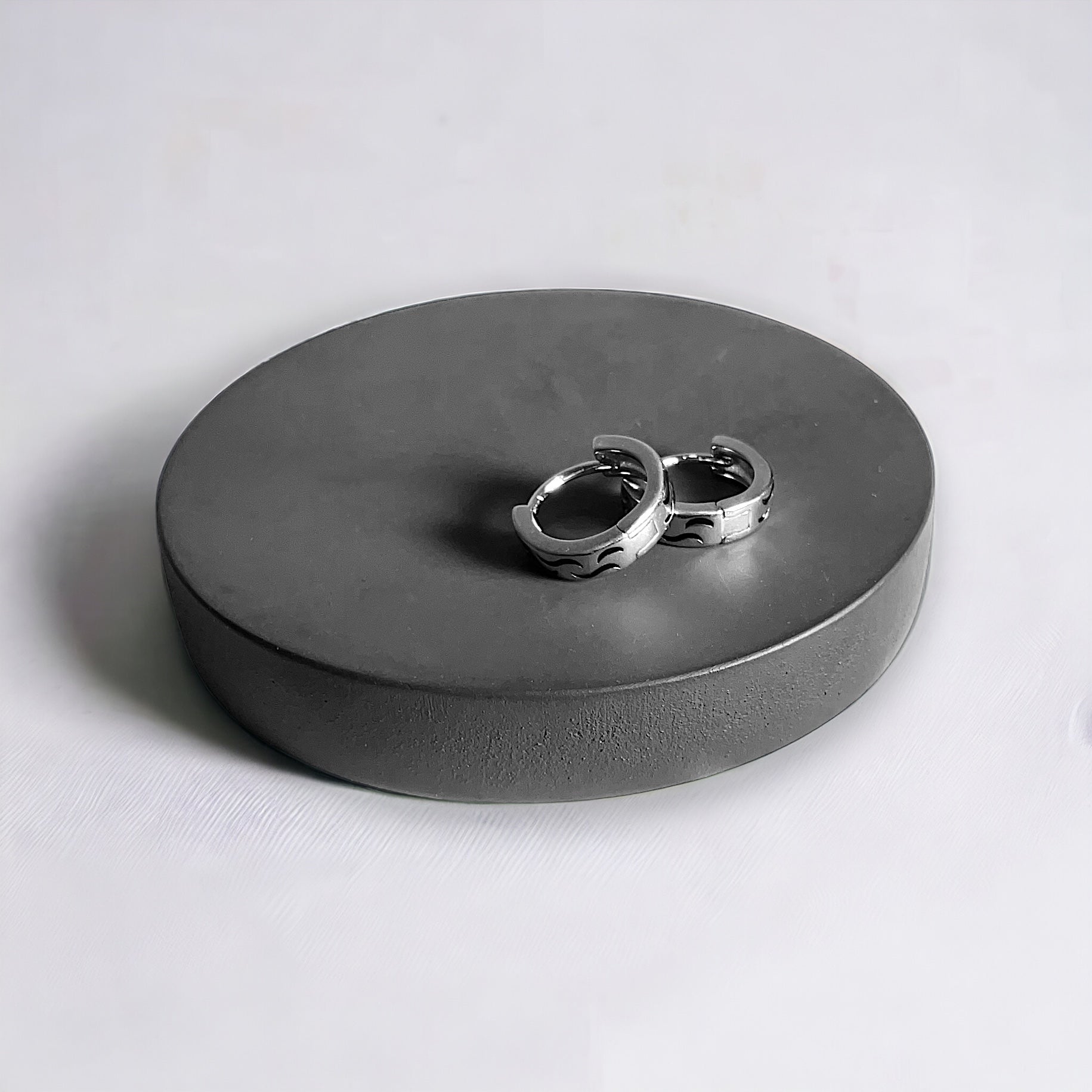 a couple of rings sitting on top of a metal box