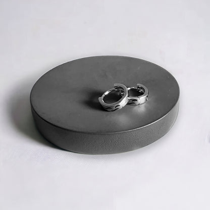 a couple of rings sitting on top of a metal box