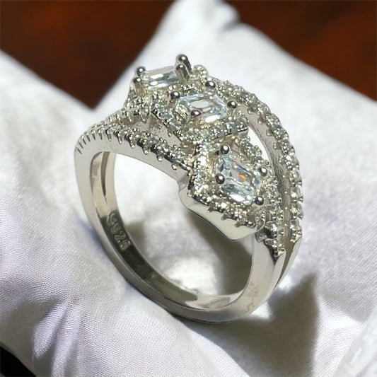 a diamond ring is sitting on a white cloth