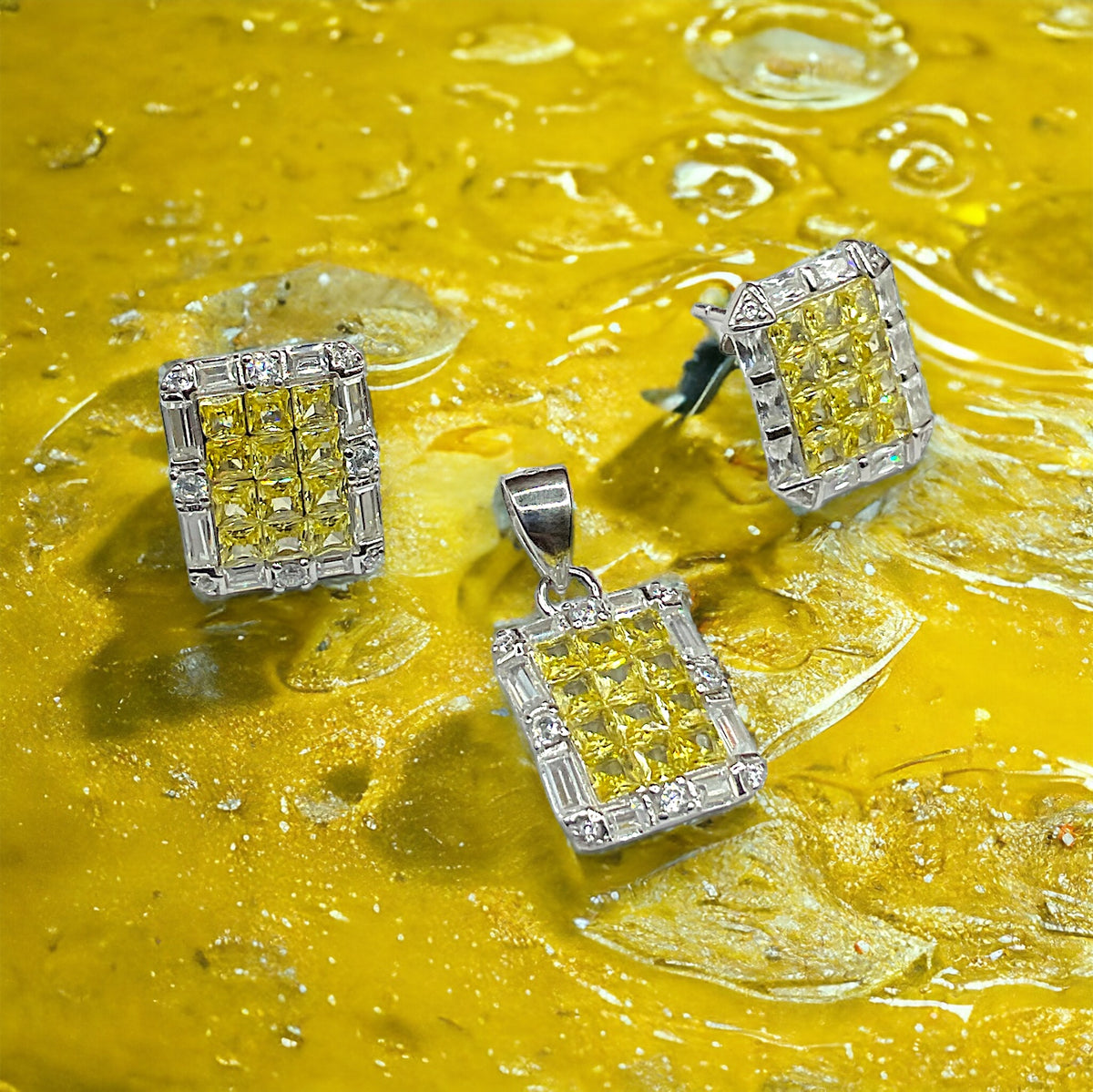 a pair of yellow and white diamond earrings