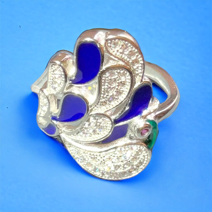 a silver ring with blue and white stones