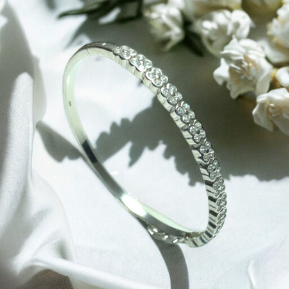 a close up of a wedding ring on a white cloth