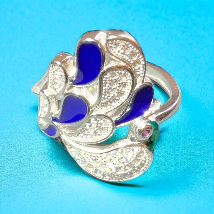 a silver ring with blue and white stones