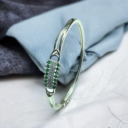 a close up of a bracelet on a bed