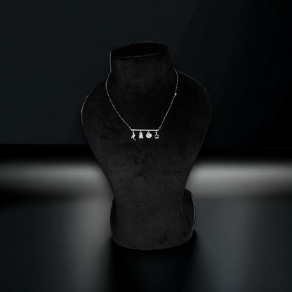 a necklace on a mannequin with a black background