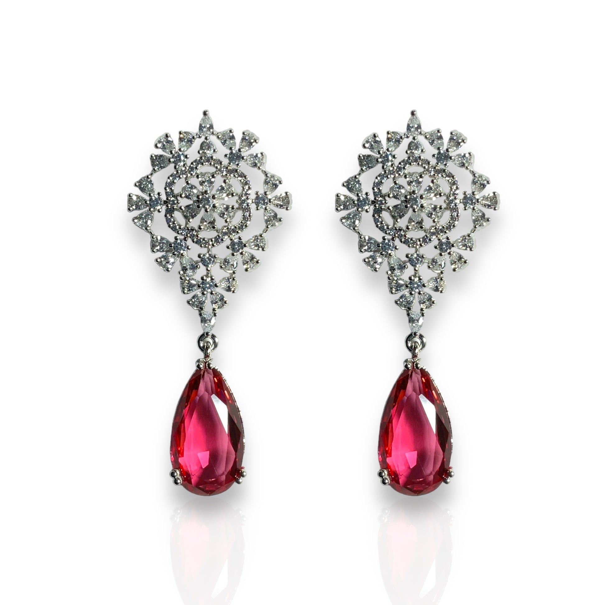 a pair of red and white earrings