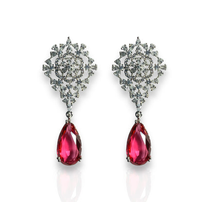 a pair of red and white earrings