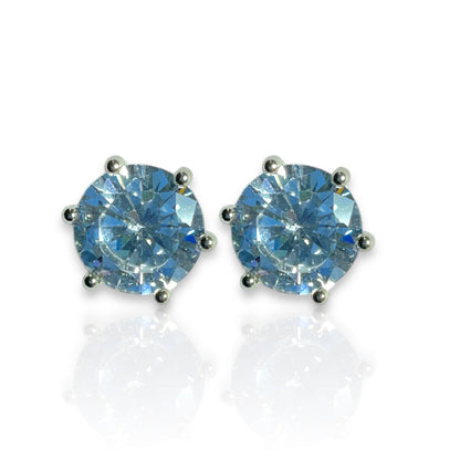 a pair of blue diamond earrings on a white background