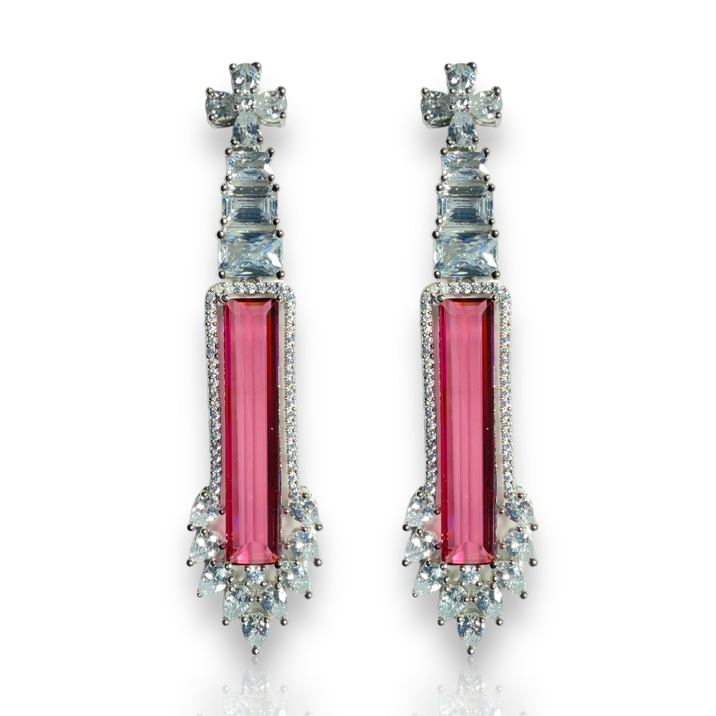 a pair of pink and white earrings