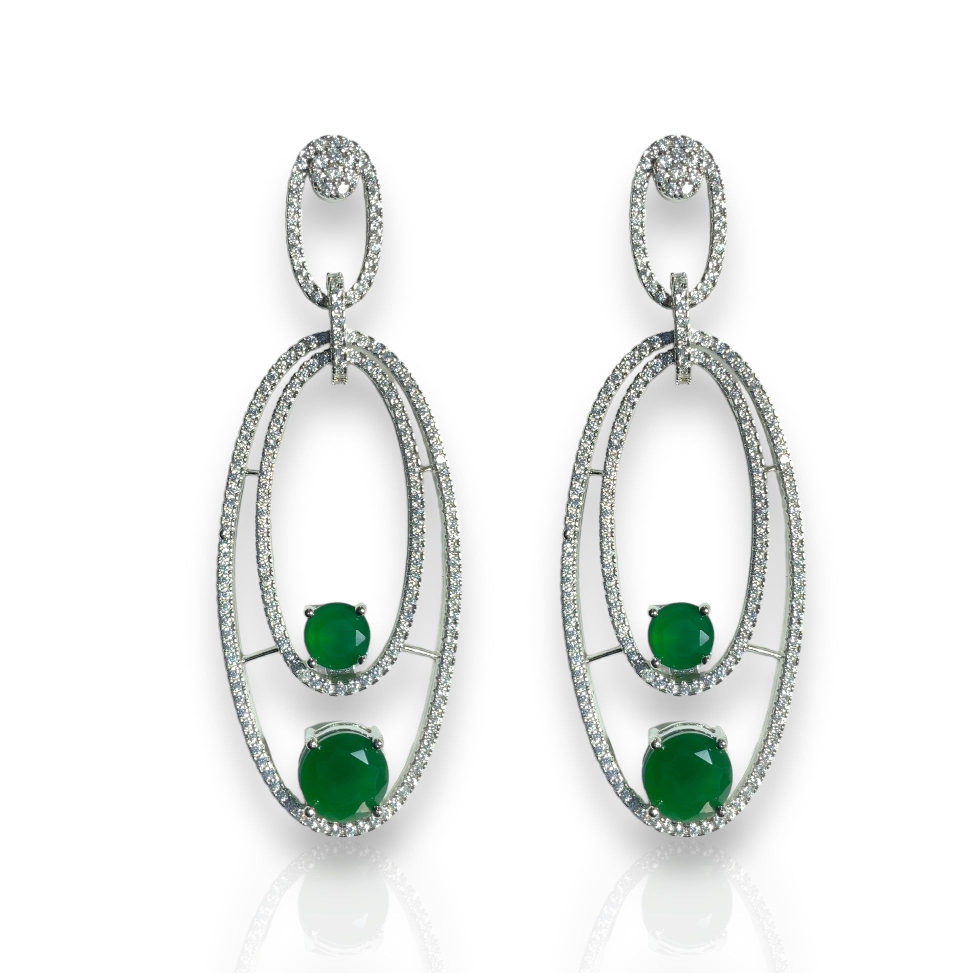 a pair of emerald and diamond earrings