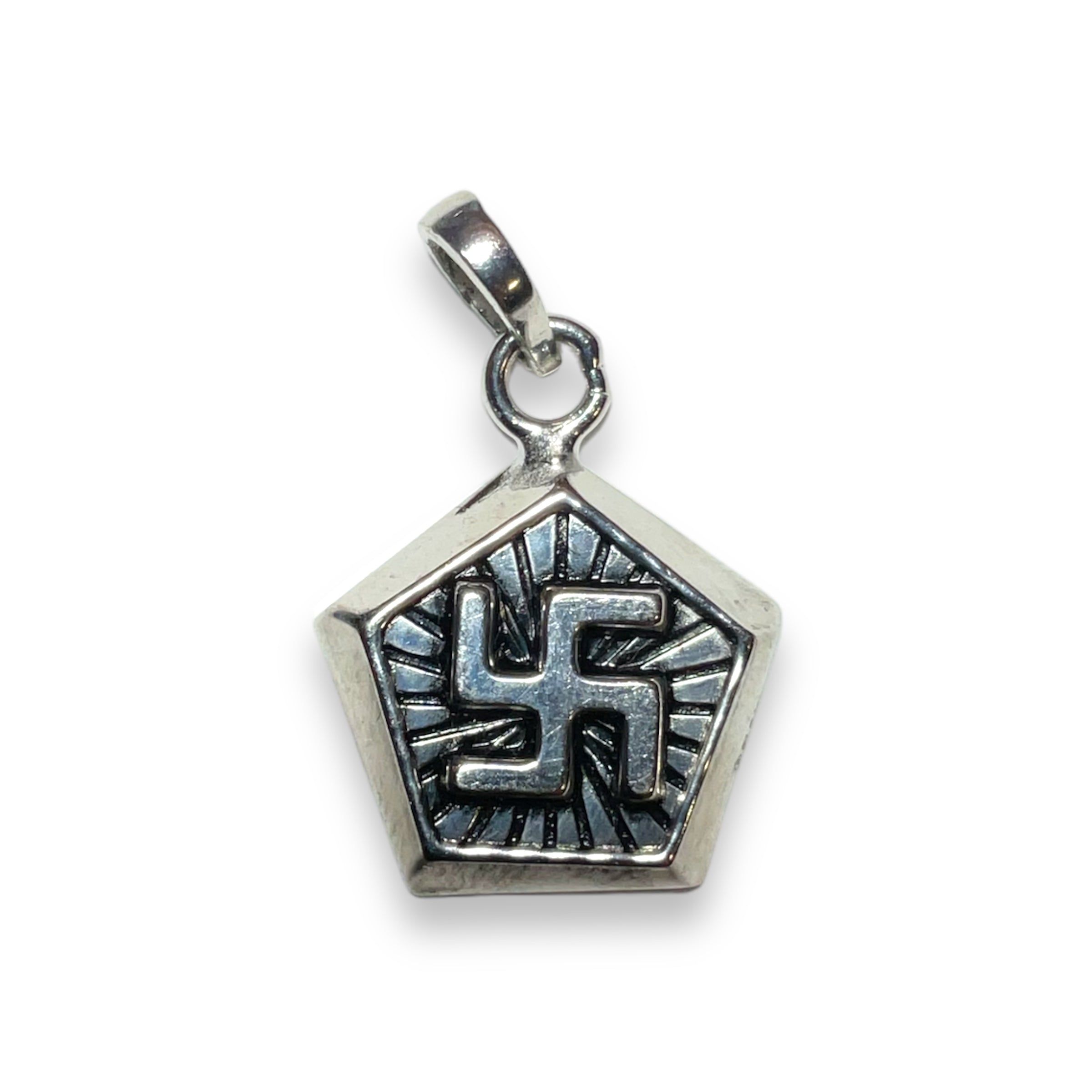 a silver charm with a cross on it