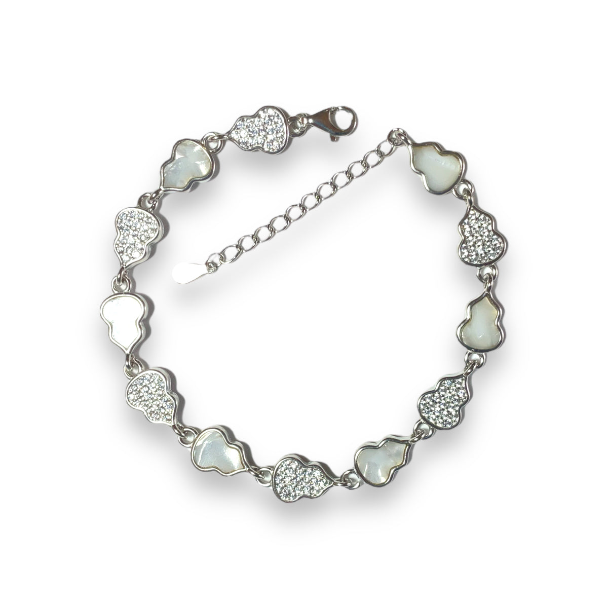 a bracelet with hearts and crystals on a white background