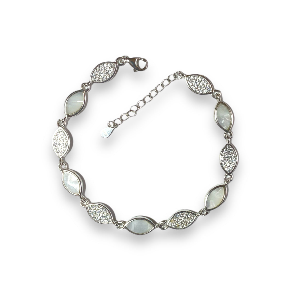 a silver bracelet with white stones on a white background