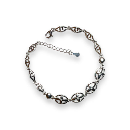 a silver bracelet on a white background