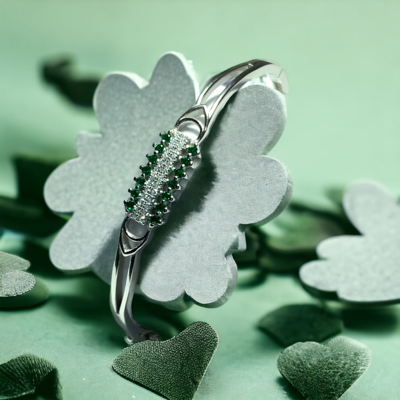 a close up of a ring with a flower on it