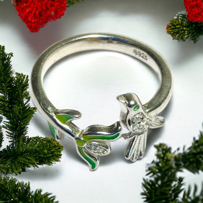 a close up of a ring with a bird on it